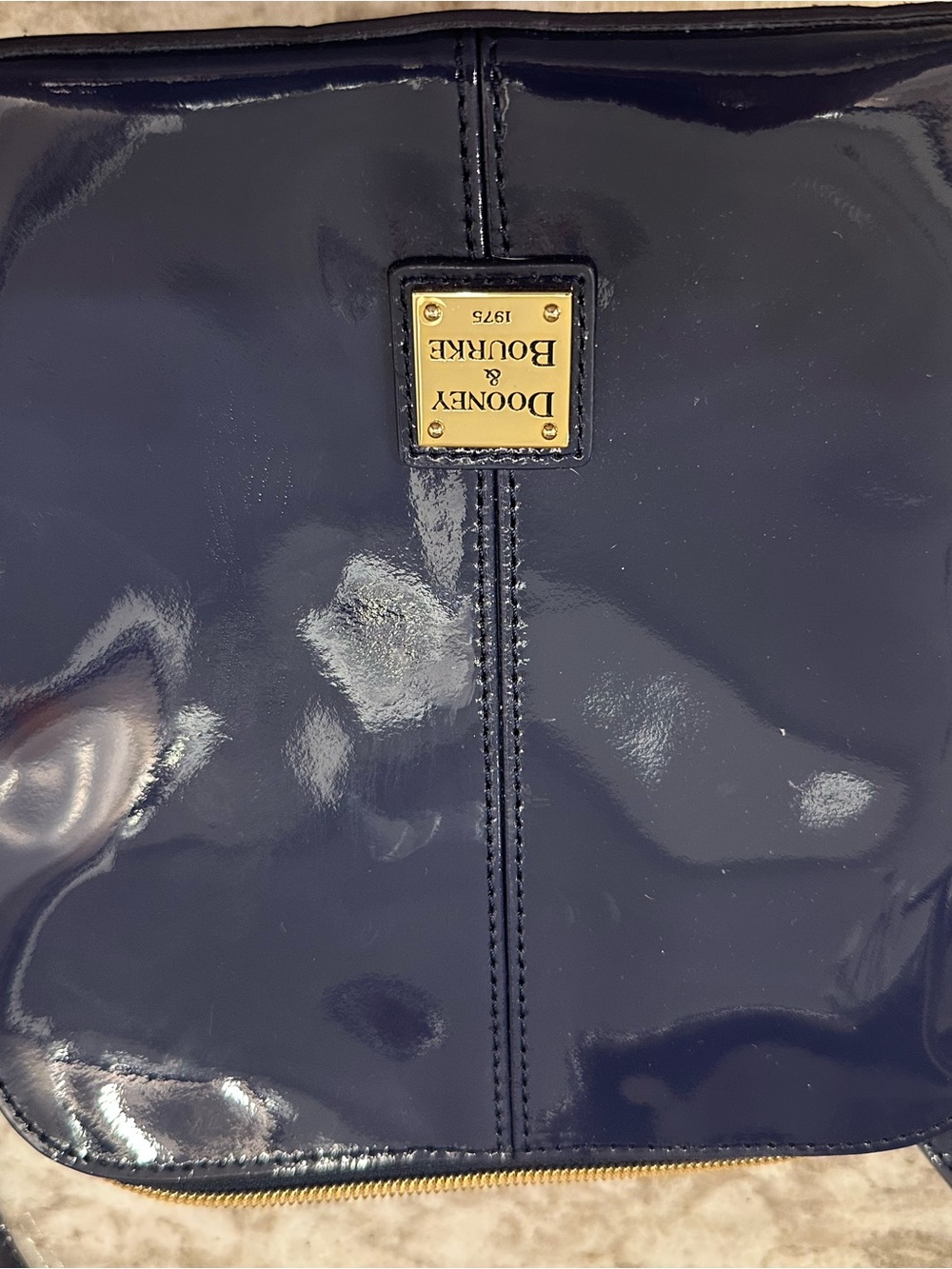 Dooney & Bourke Navy Patent Leather Crossbody with Gold Plate